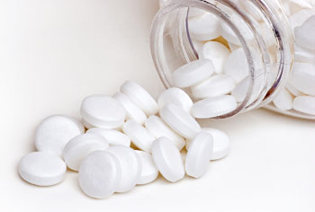 Aspirin bottle and pills