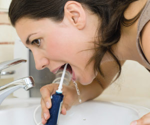 Cleaning between your teeth.