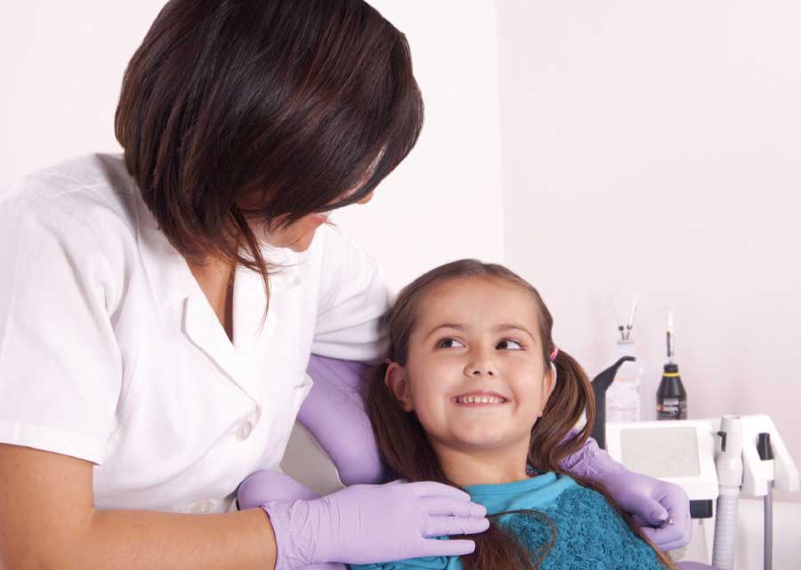 Dentist applying topical fluoride.