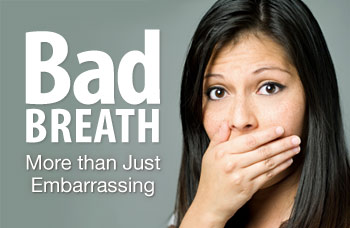 Woman covering mouth with bad breath.