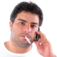 Smoking while talking on the cell phone.