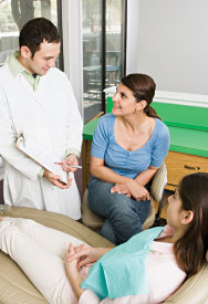 Dentist consulting with a patient.