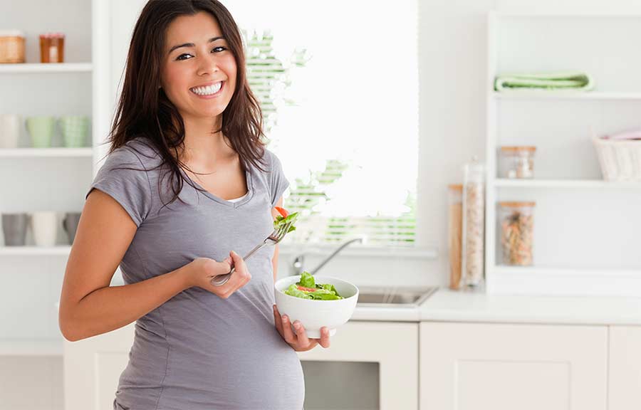 Pregnant woman eating.