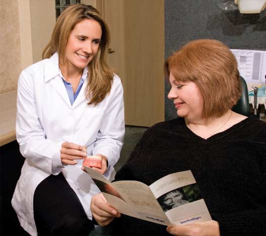 Dr. Jessica Logan talking to patient about invisalign.